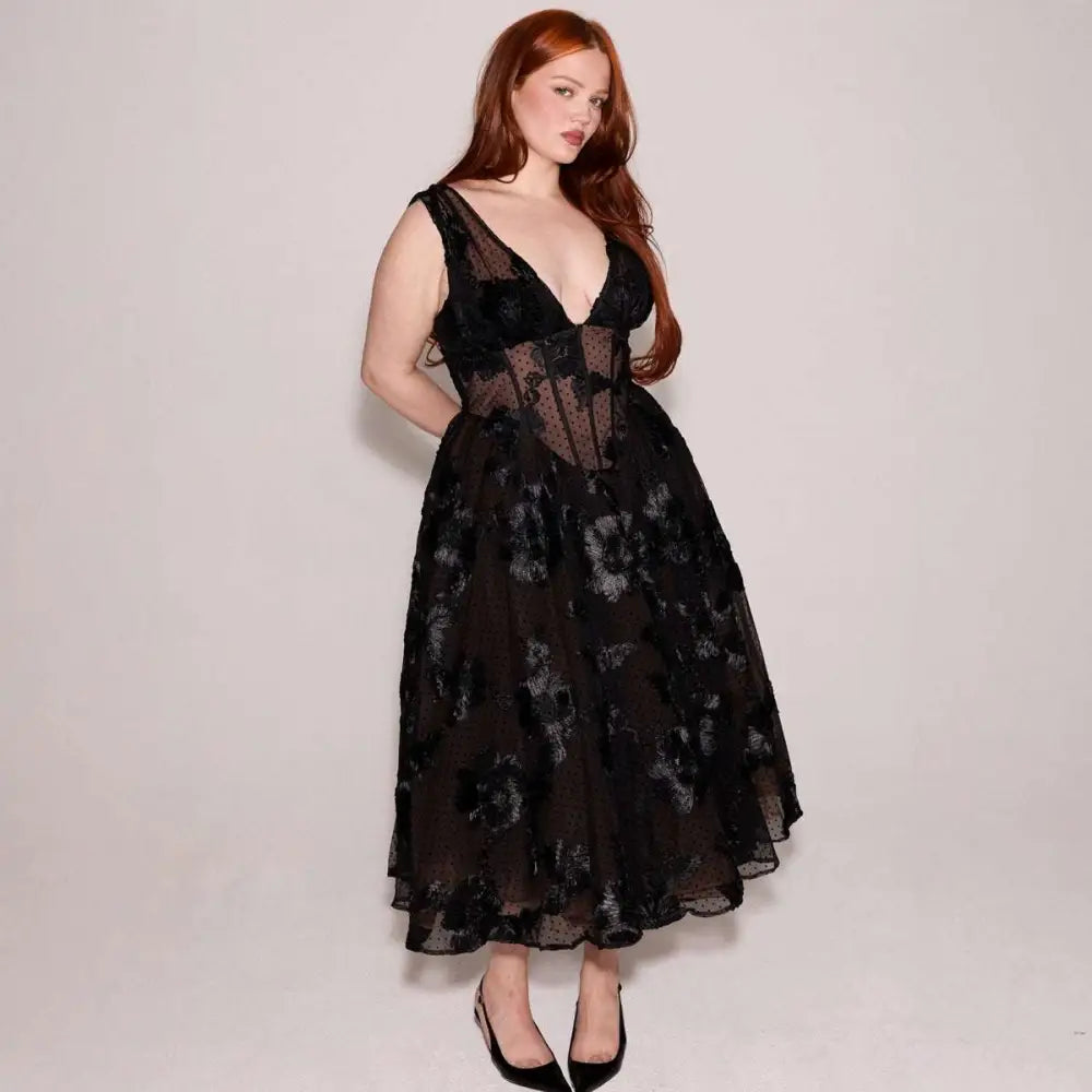 Black deep v-neck lace mesh evening dress featuring a sheer bodice and floral patterned midi skirt