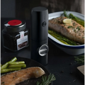 Black electric kitchen household grinder set with cylindrical body silver dial and textured grip for easy use