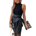 Black high-neck sleeveless top paired with a black faux leather bow pleated skirt autumn for stylish layering