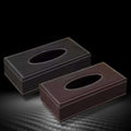 Two rectangular leather tissue box covers in dark and light brown with white stitching for car tissue box use