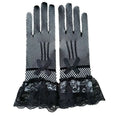 Black fishnet stretch mesh gloves with lace cuffs featuring satin bows and ruffles in a knitted stretch mesh design