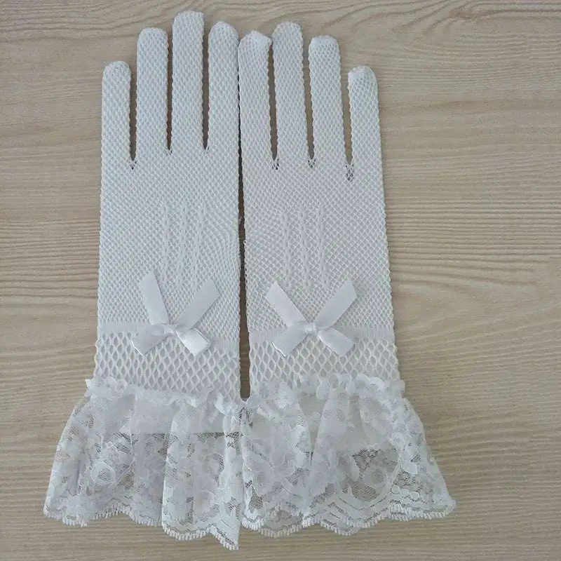 White stretch mesh gloves with lace cuffs featuring delicate bows and ruffled trim in a pair knitted stretch design