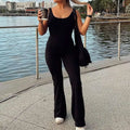 Black flared slim fit hip raise jumpsuit with sleeveless design and flared legs for a stylish silhouette