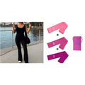 Set of three pink resistance bands with matching pouch paired with black flared slim fit hip raise jumpsuit