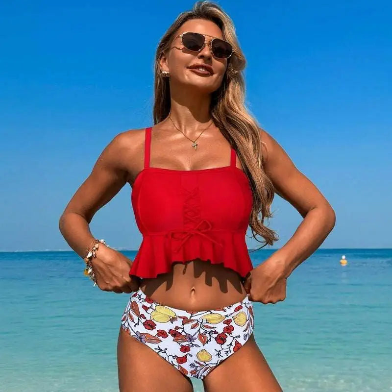 Red ruffled crop top with front bow detail paired with a black floral conservative split slimming swimsuit