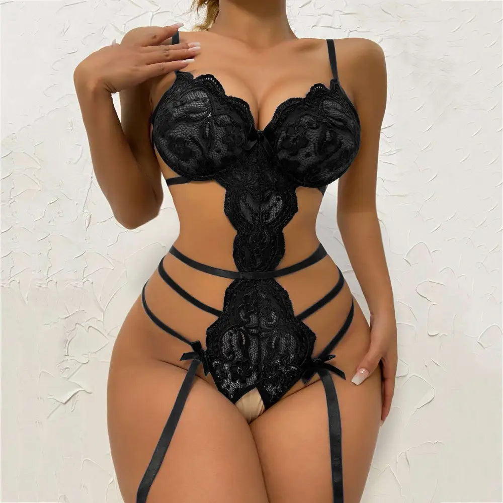 Black floral lace transparent bodysuit pajamas featuring intricate floral patterns and thin straps in black lace material