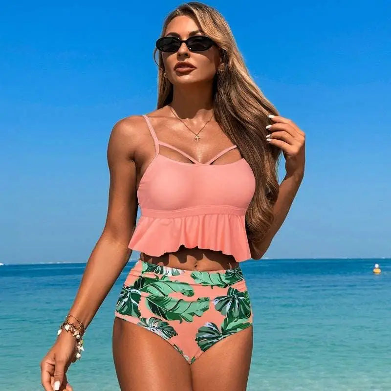 Pink two-piece women’s swimsuit bikini with ruffled top and tropical leaf print high waisted bottoms