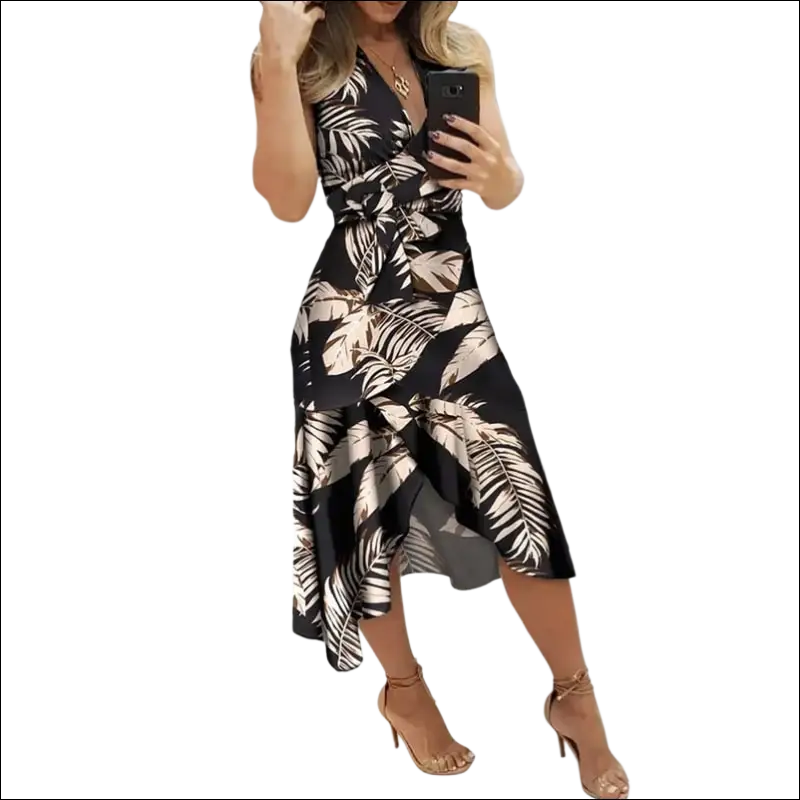 Black floral slim fit wrap dress featuring a black and beige tropical leaf print with v-neckline in slim fit design