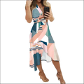 A black floral slim fit wrap dress with a bold geometric pattern in pink teal white and navy blue with striped accents