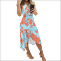 Black floral slim fit wrap dress in light blue with vibrant orange floral patterns and a cinched waist bow