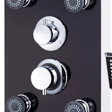Chrome-finished shower control panel with circular knobs and black-faced spray heads on black glass shower with rain showerhead and massage jets