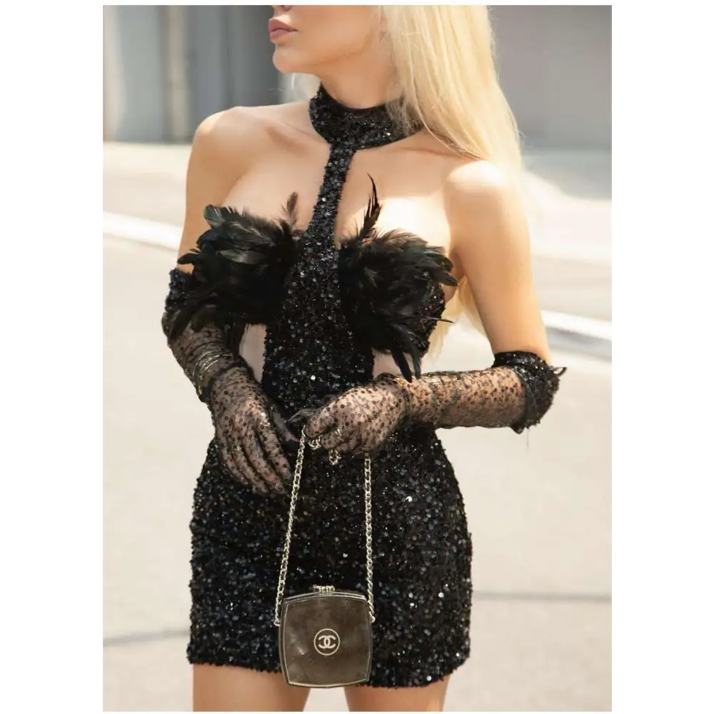 Black halter feather sequins short mini dress with black sequined fabric and sheer lace gloves visible