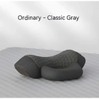Classic gray heated cervical pillow made of memory foam with textured quilted surface for ergonomic neck support