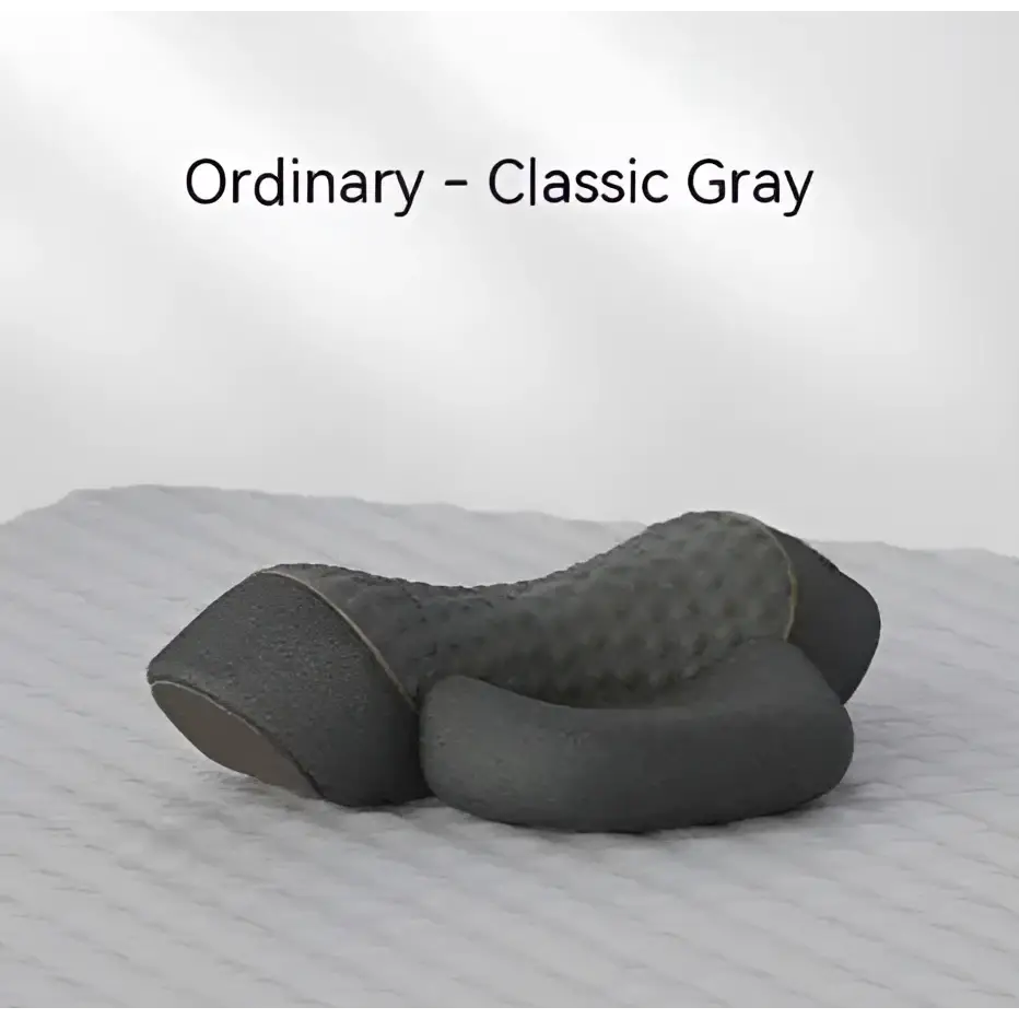 Classic gray heated cervical pillow made of memory foam with textured quilted surface for ergonomic neck support