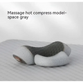Gray massage hot compress pillow with textured cushioned surface and contoured design for neck support in black heated cervical pillow wrap