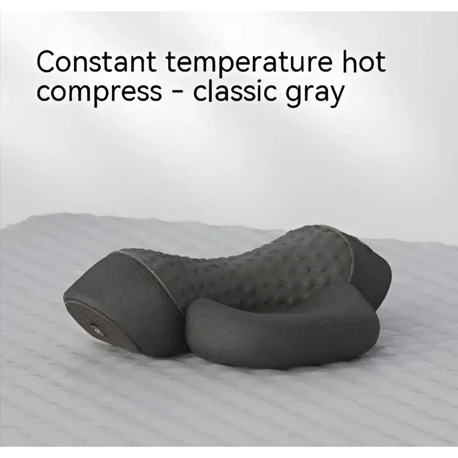 Classic gray textured heated cervical pillow with quilted surface and contoured design for targeted neck relief