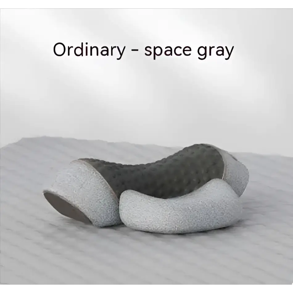 Space gray black heated cervical pillow with ergonomic textured contour and soft cushioned neck support wrap