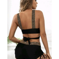 Black high waist bikini with gold chain detailing on straps and waistband featuring a back tie design view