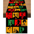 Black table runner with vibrant pop art portraits in red green and yellow celebrating black history month