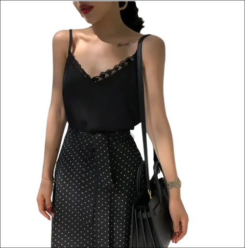 Black lace camisole with lace trim and spaghetti straps showcasing luxury women’s fashion essentials
