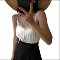 White lace-trimmed lace camisole with spaghetti straps in luxury women’s fashion for elegant layered looks