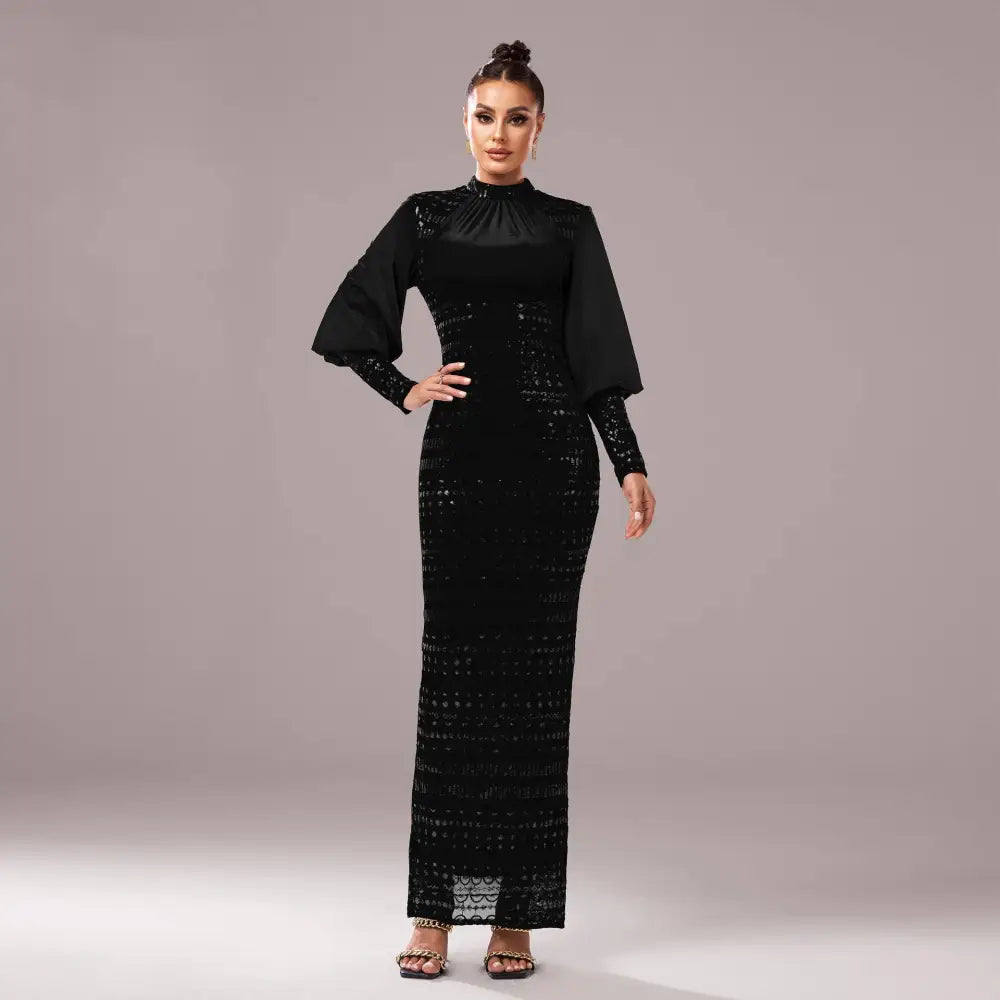 Black lace sequined maxi dress with round neck, long bell sleeves, and intricate lace detailing in black fabric