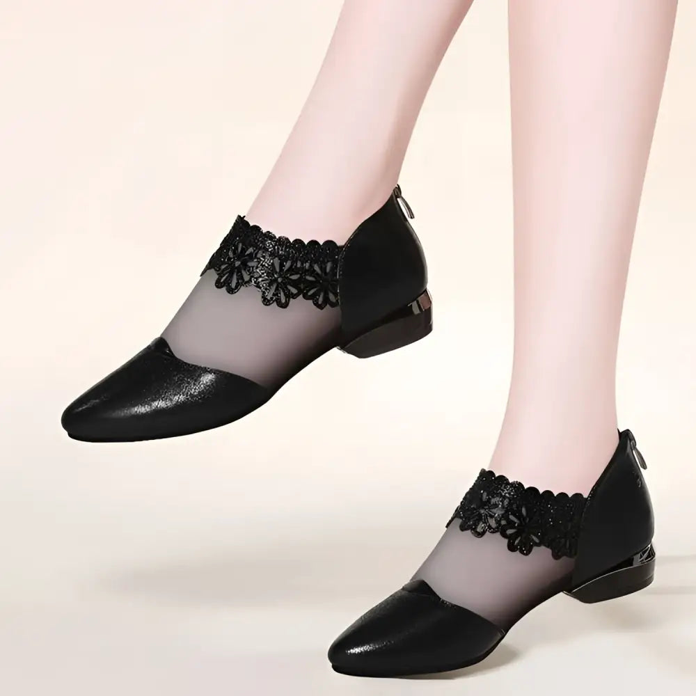 Black lace mesh women’s sandals with floral lace detailing ankle straps and glossy leather toe flats