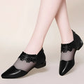 Black lace mesh women’s sandals with glossy leather toe and transparent mesh overlay on low block heel