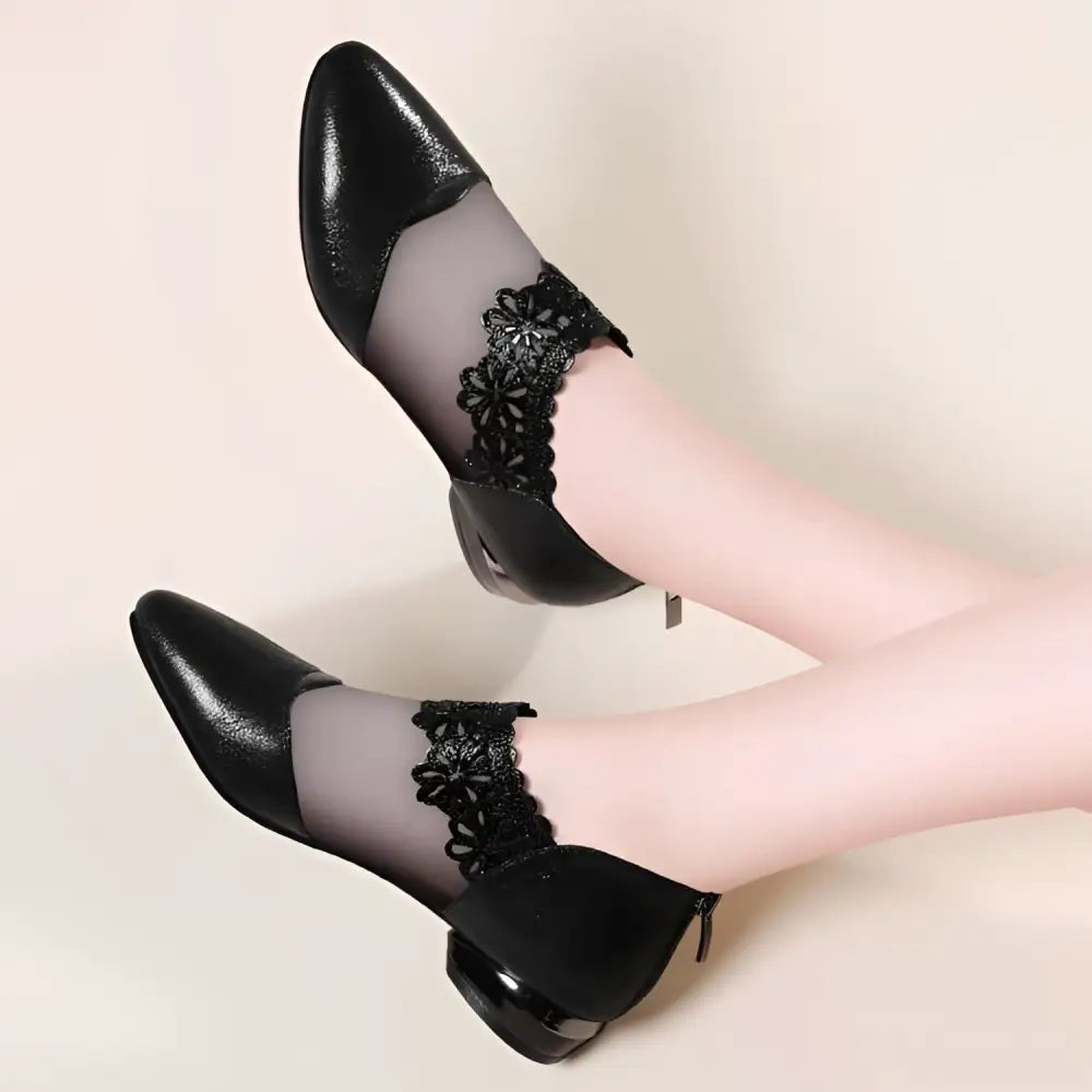 Black lace mesh women’s sandals featuring black leather ankle boots with sheer mesh panels and intricate lace detailing