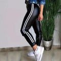 Black faux leather hip lifting tight trousers with two white vertical stripes for american sexy tight look