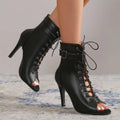 Black leather peep toe high heel pumps featuring lace-up design and stiletto ankle boots style