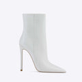 White patent leather stiletto ankle boots with a sleek pointed toe and slender high heel for elegant wear