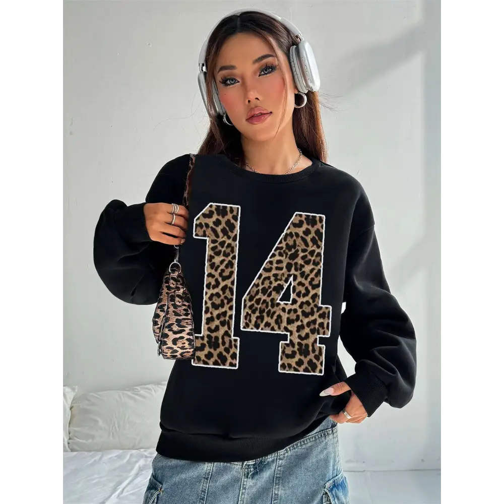 Black crew neck sweatshirt featuring a bold leopard print number 14 appliquéd across the chest