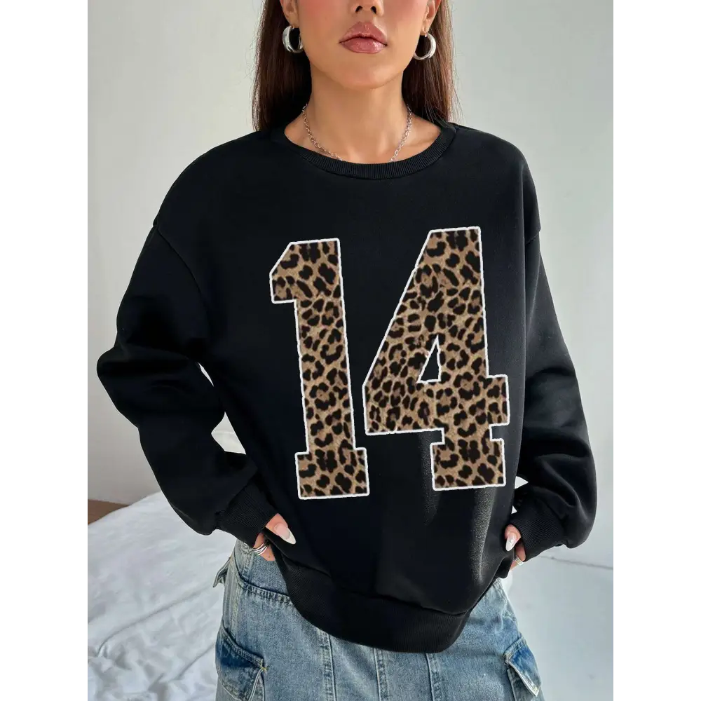 Black crew neck sweatshirt featuring bold leopard print number 14 on the front for stylish casual wear