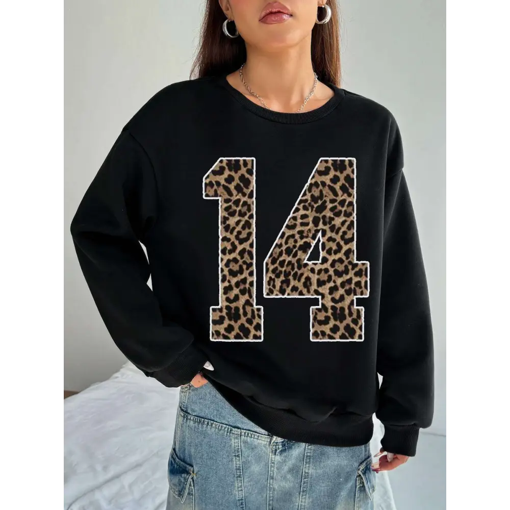 Black crew neck sweatshirt featuring bold leopard print number 14 on the front for casual wear