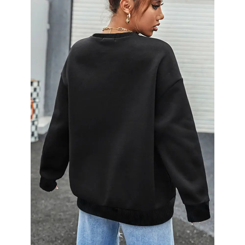 Black oversized crew neck sweatshirt with ribbed cuffs and hem featuring black leopard number 14 design