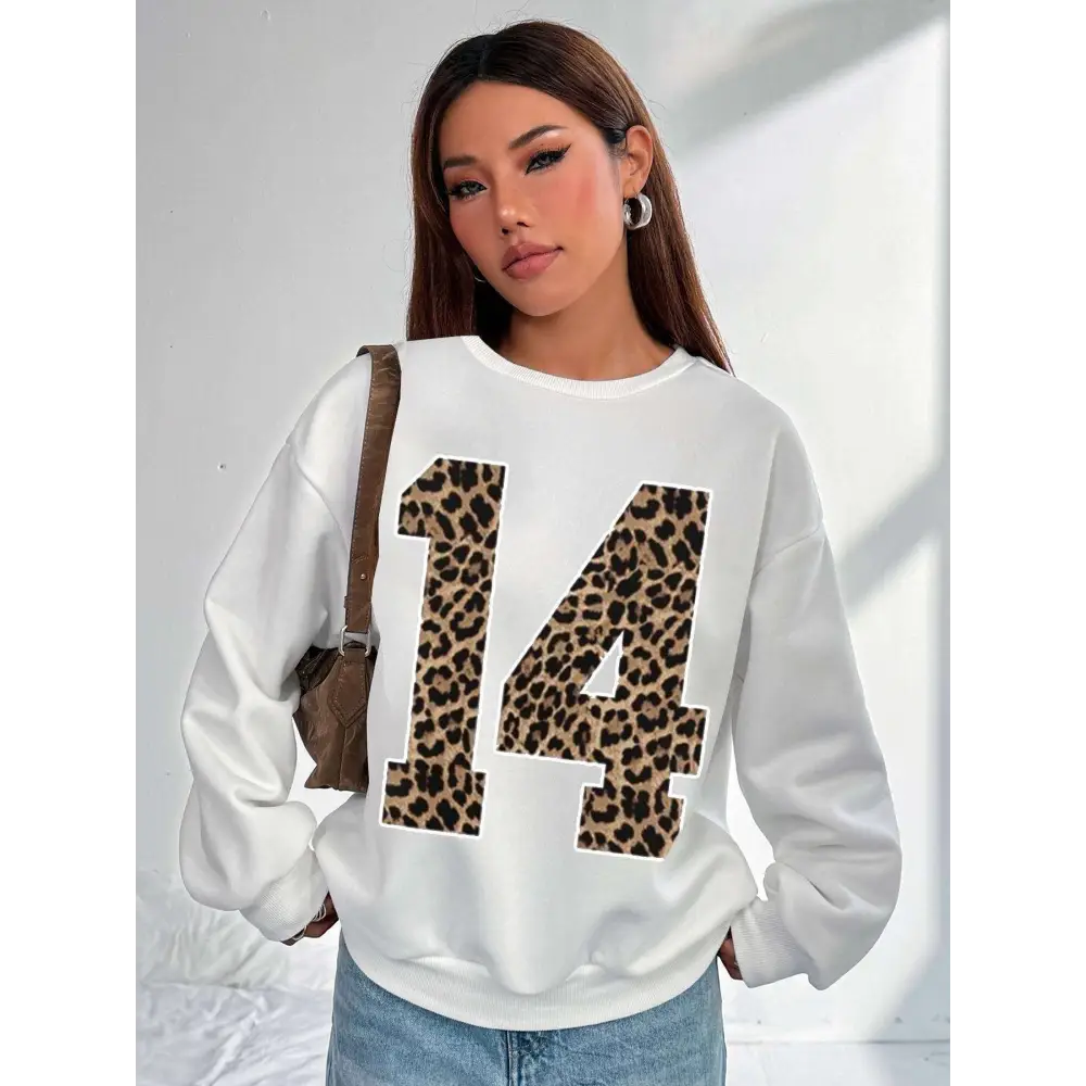 White crew neck sweatshirt featuring a bold black leopard number 14 with leopard print number detail on the front