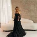Elegant black long sleeve transparent lace wedding dress with off-the-shoulder sheer puffed sleeves and flowing train
