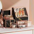 Black marble glass makeup organizer with rose gold accents and transparent drawers for vanity organization