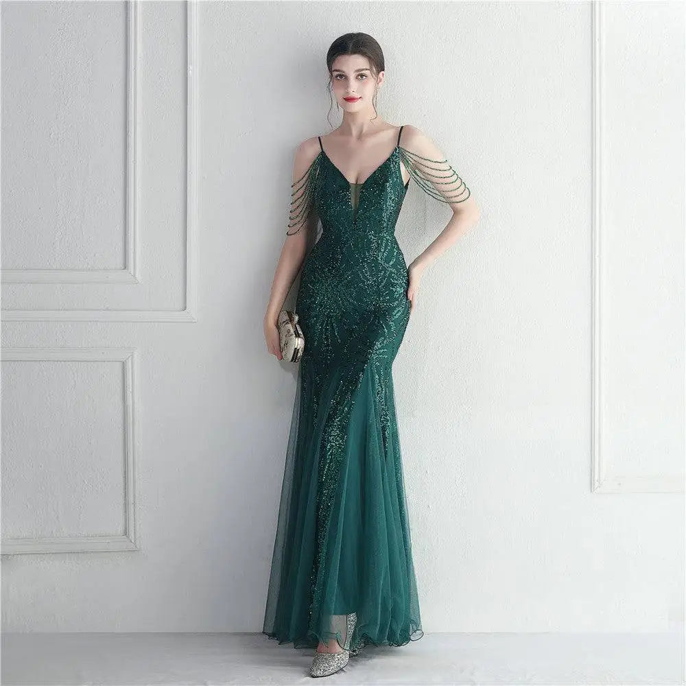 Emerald green mermaid evening gown with sequined bodice and sheer tulle skirt for mesh beaded bridal wedding dinner