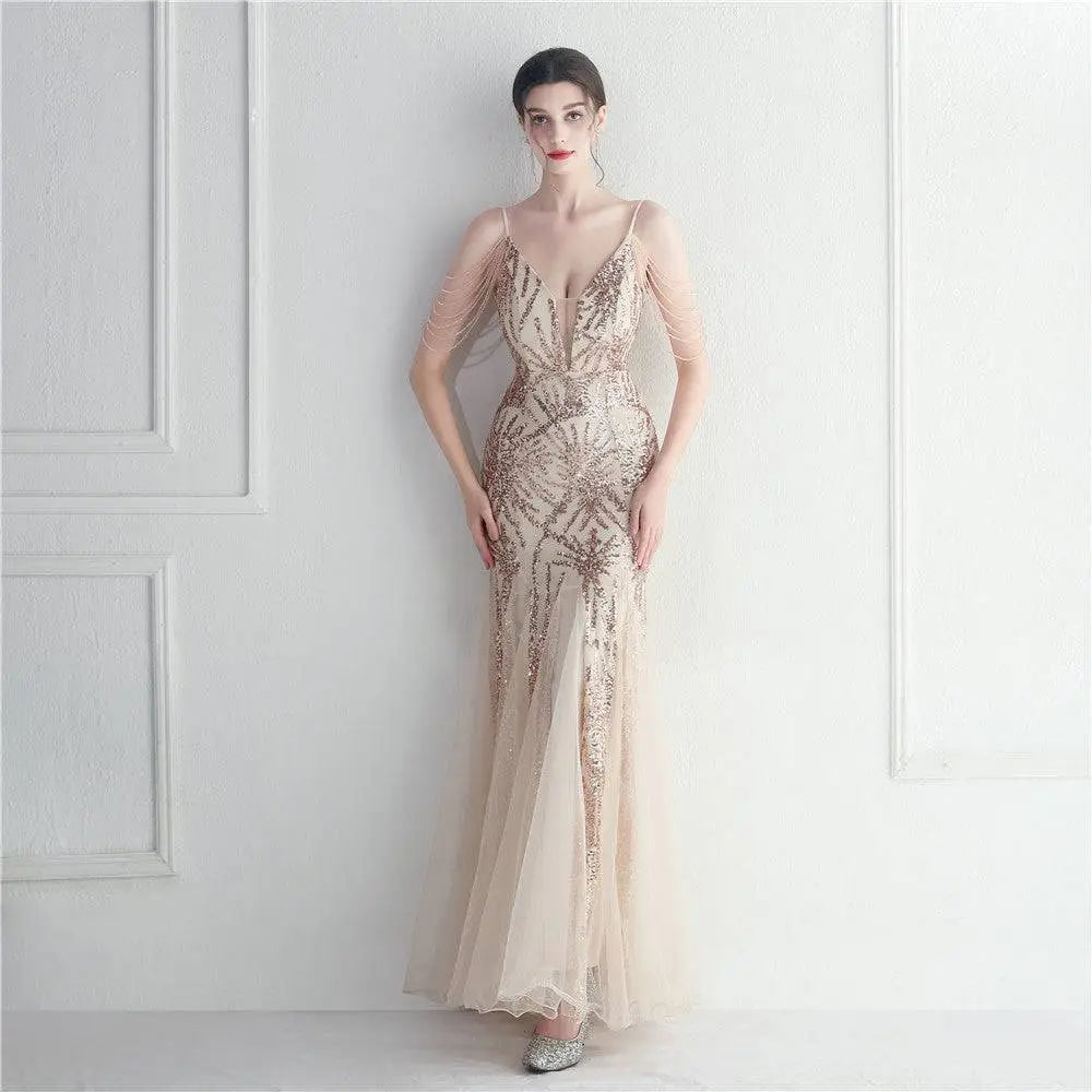 Shimmering champagne-colored evening gown with gold sequin patterns and sheer fabric for mesh beaded bridal wedding dinner