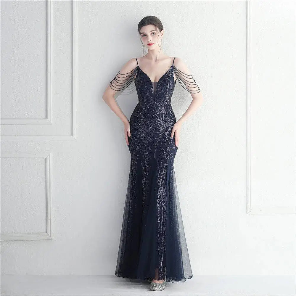 A navy blue mermaid-style black mesh beaded bridal wedding dinner gown with intricate sequin detailing and sheer straps
