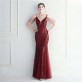 A shimmering burgundy mesh beaded bridal wedding gown with intricate sequins and delicate beaded shoulder straps