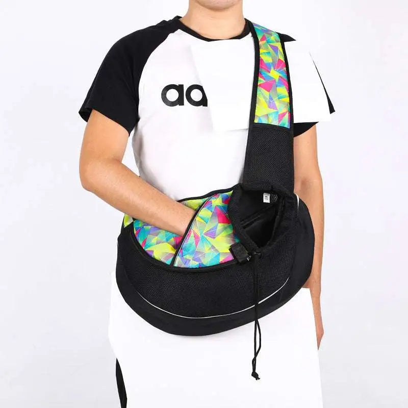 Black mesh carrying pets bag for women with vibrant geometric strap and interior lining for outdoor use