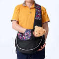 Black mesh carrying pets bag for women with vibrant purple pink white geometric straps and interior lining for outdoor use