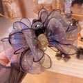 Black mesh rhinestone large korean style flower clip with a sparkling black sheer organza bow and gold glitter accent