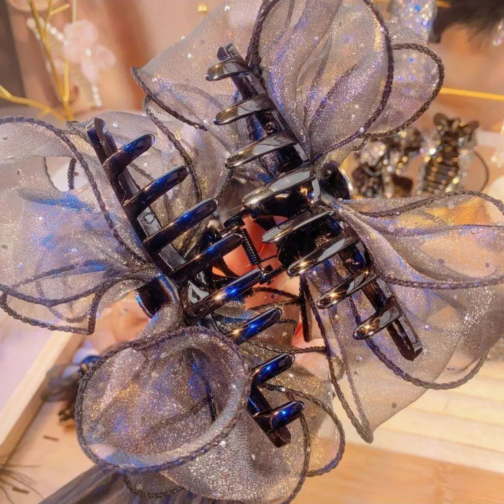 Black mesh rhinestone large korean style flower clip featuring a glittering black claw clip with sheer sparkly mesh fabric