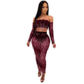 A shimmering burgundy mesh sequins tassel two piece set with long fringe on crop top and high-waisted pants