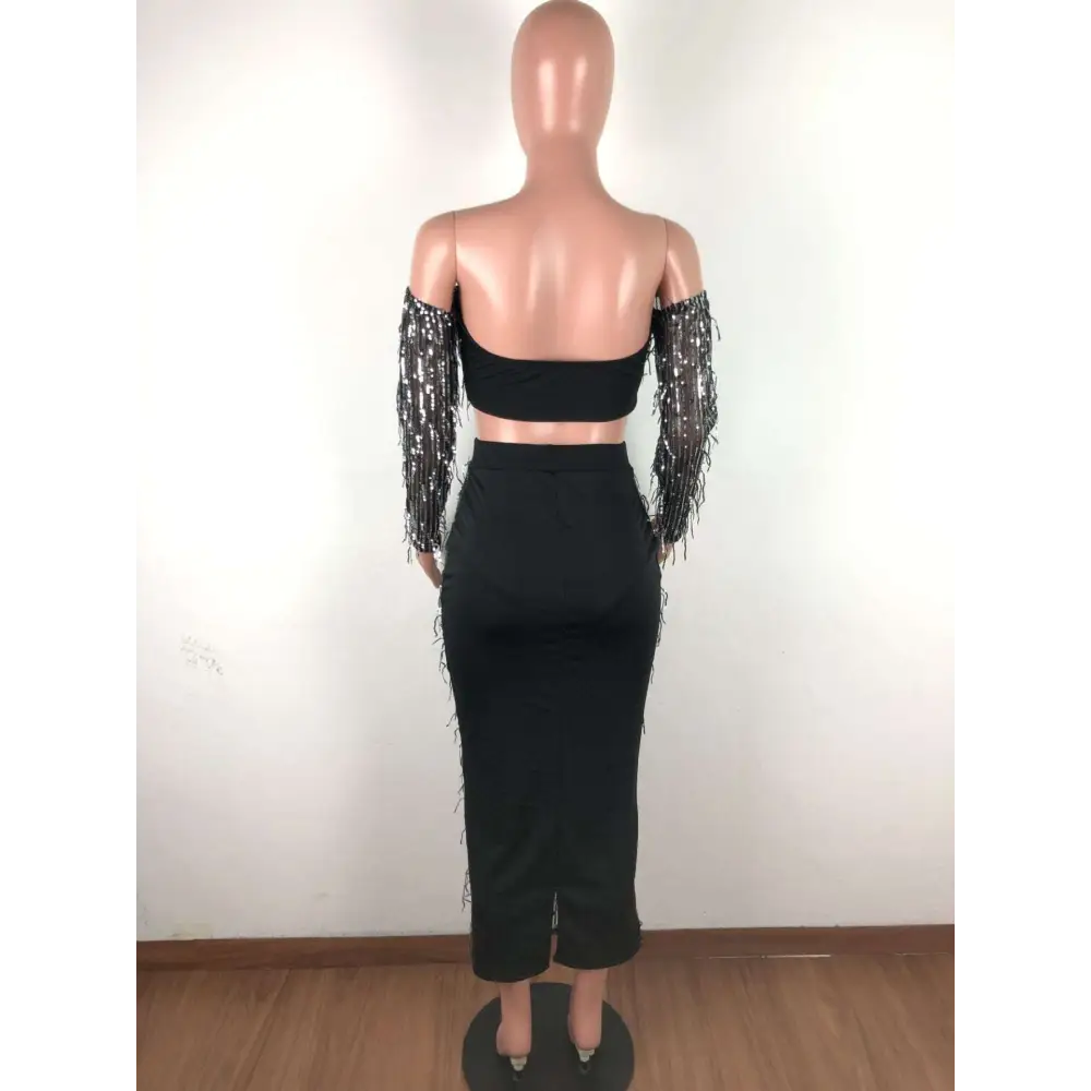 Black mesh sequins tassel two piece set featuring a fashion sexy off-the-shoulder crop top and high-waisted midi skirt