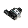 Black metal rear view reversing camera module showing black and silver automotive throttle position sensor with qr-coded label